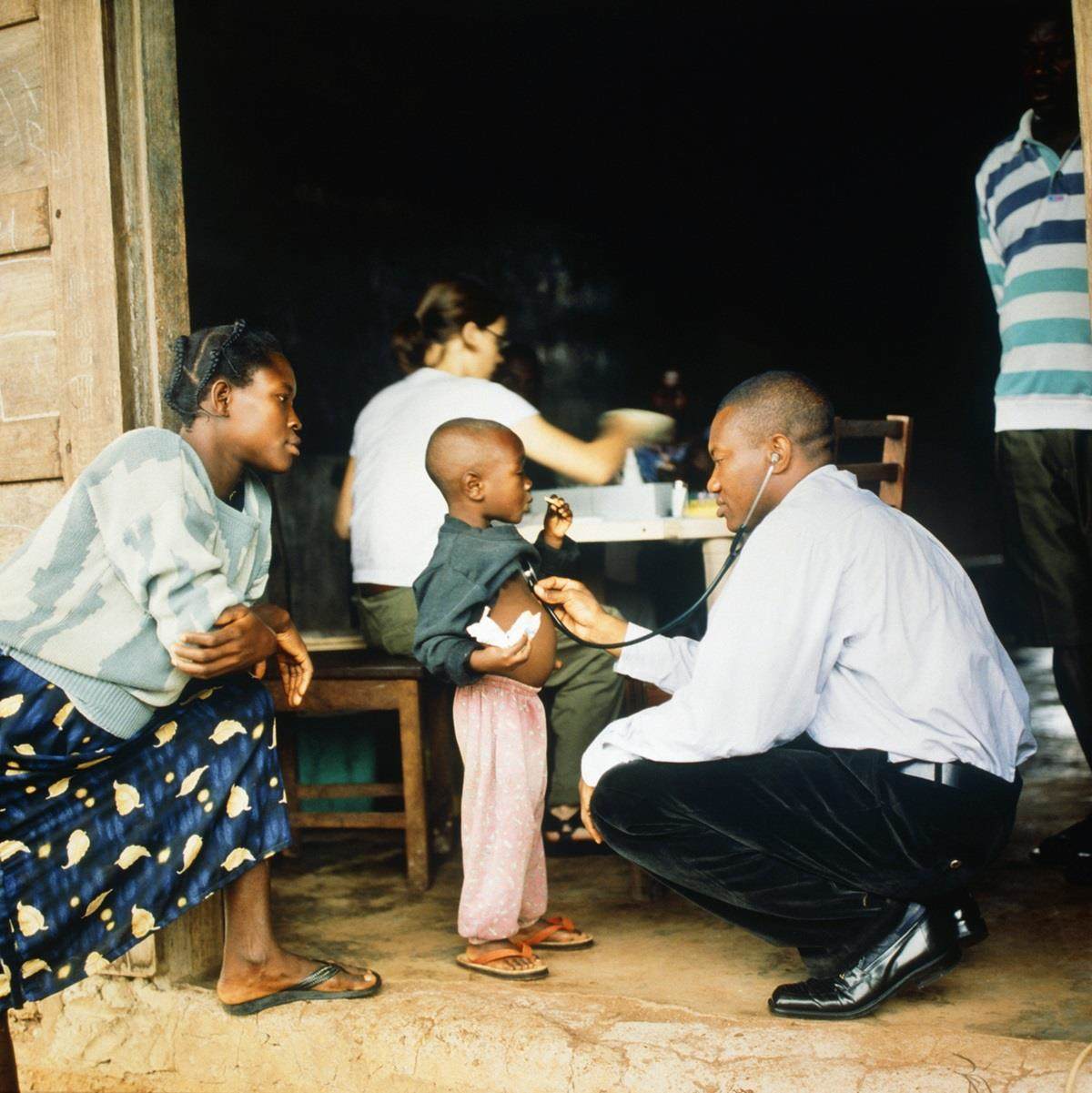 Doctor checkup with African child for health and wellness
