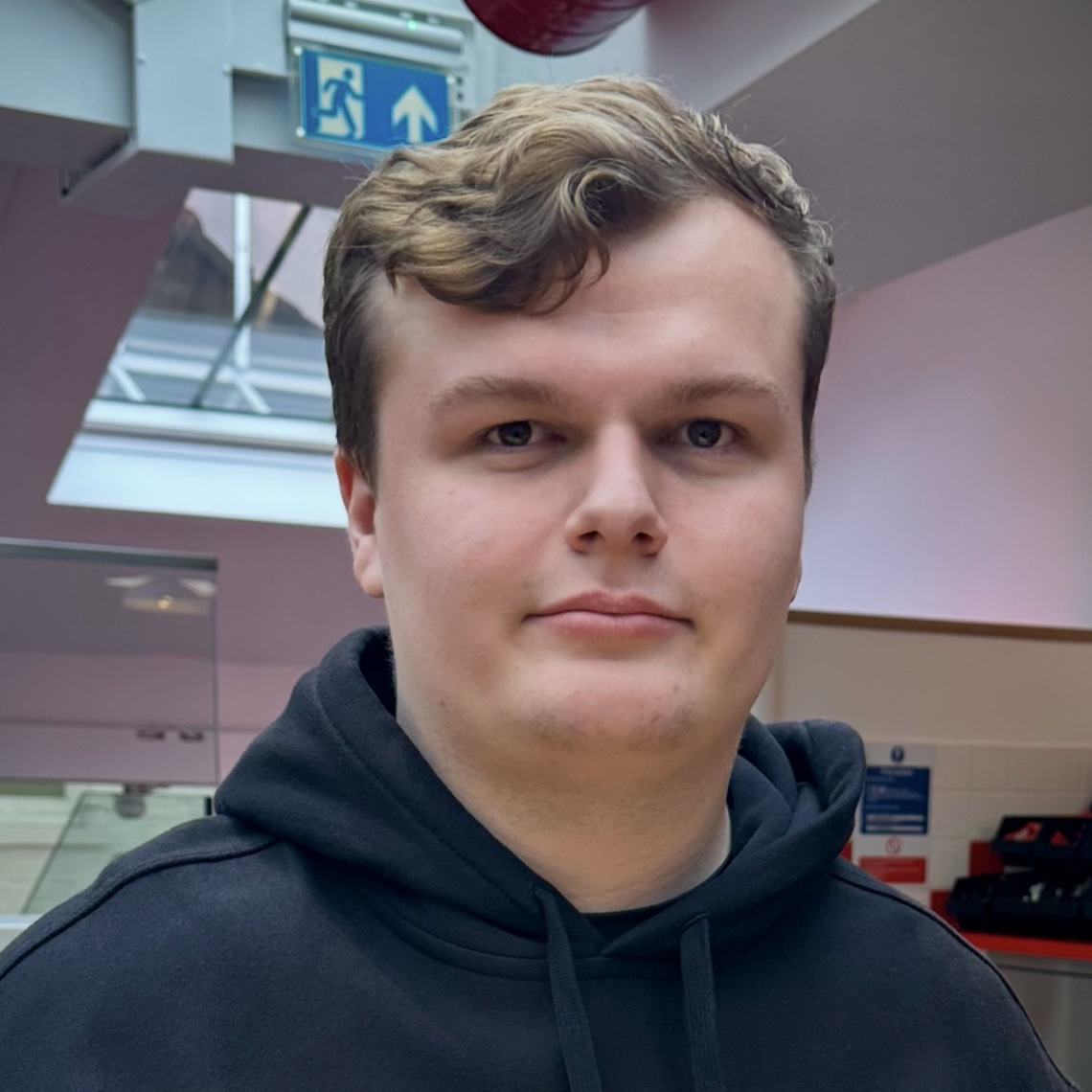 Headshot of Ben Tomlinson