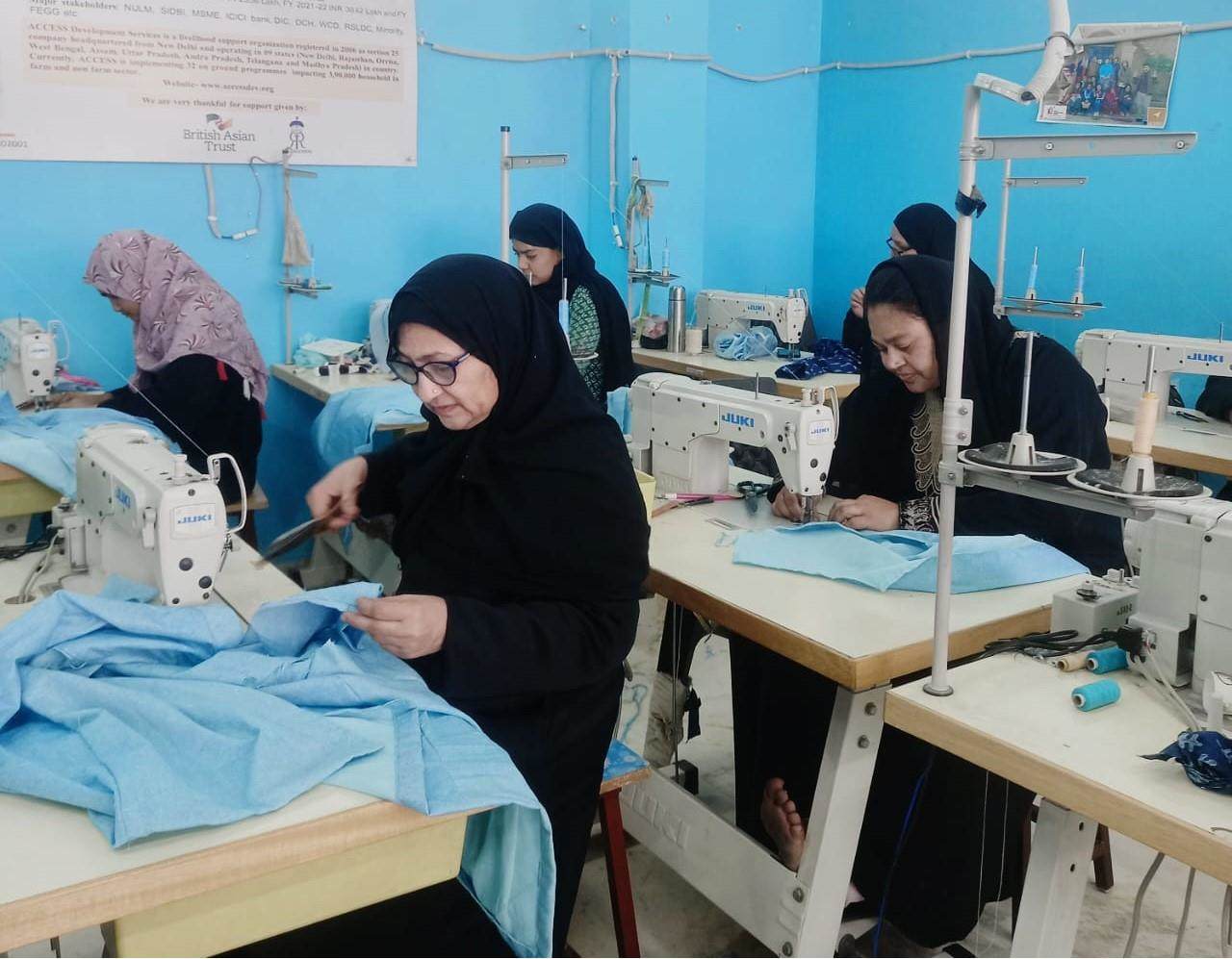 Women supported by the British Asian Trust work on sewing projects