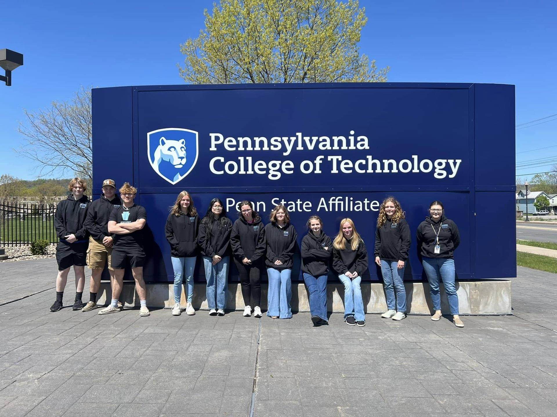 Team outside banner with logo on