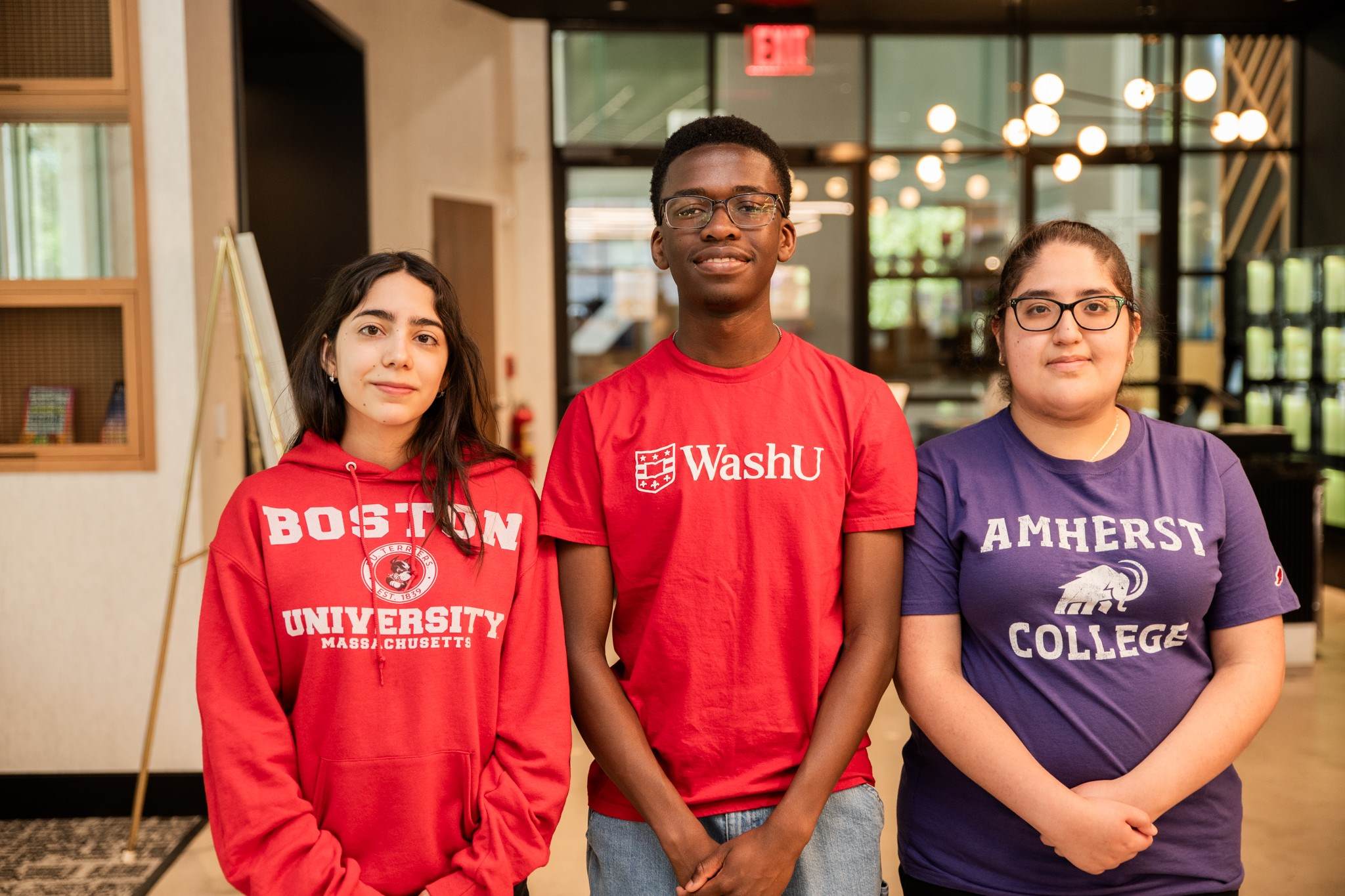 three people smiling from charity